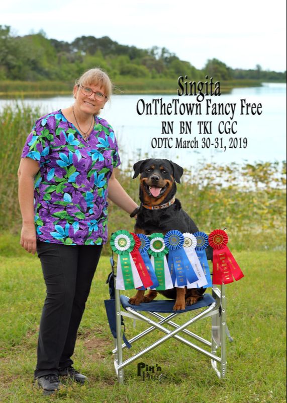 Nicky Dronoff-Guthrie and Singita the Rottweiler after an Obedience and Rally Trial in Orlando